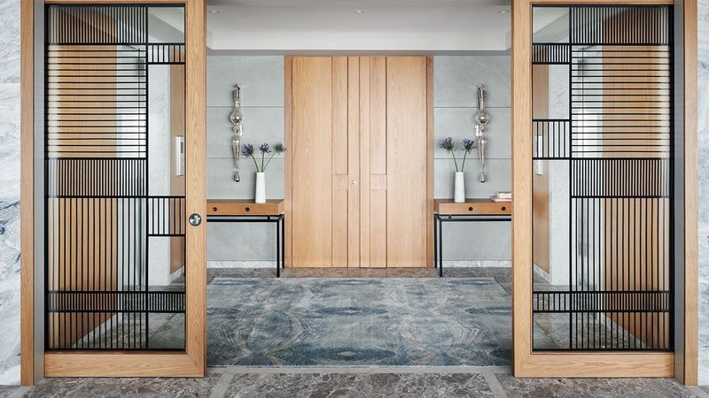 Scandinavian-Inspired Vestibule with Slatted Wood Partitions