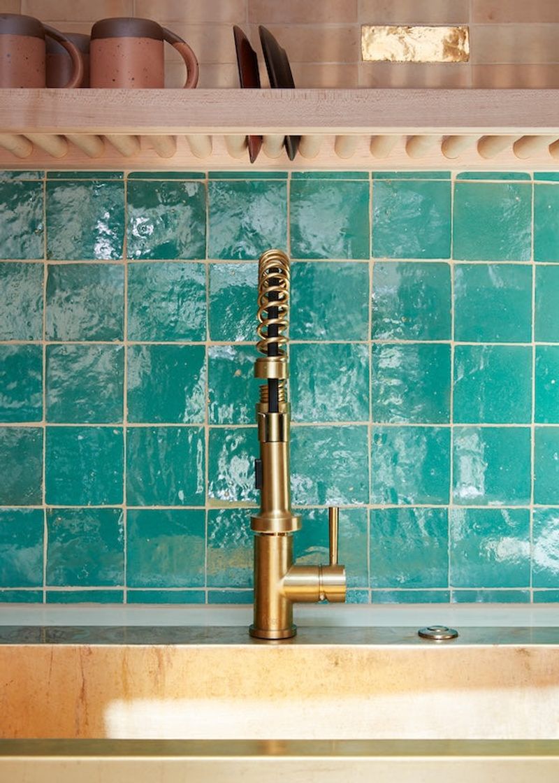 Teal Zellige Tile Backsplash Behind Copper Fixtures