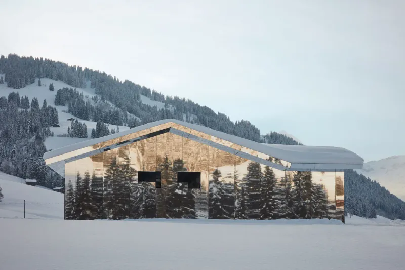 Mirrored Cabin Reflecting Alpine Scenery