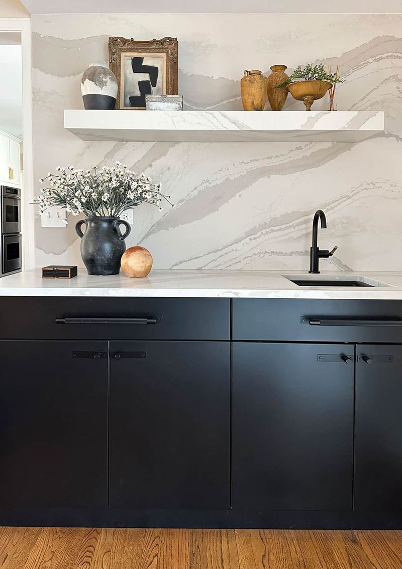 Floating Shelves Above a Marble Backsplash
