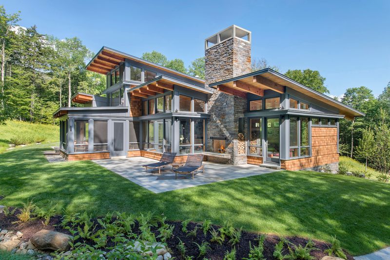 Modern Chalet Framed by Birch and Stone