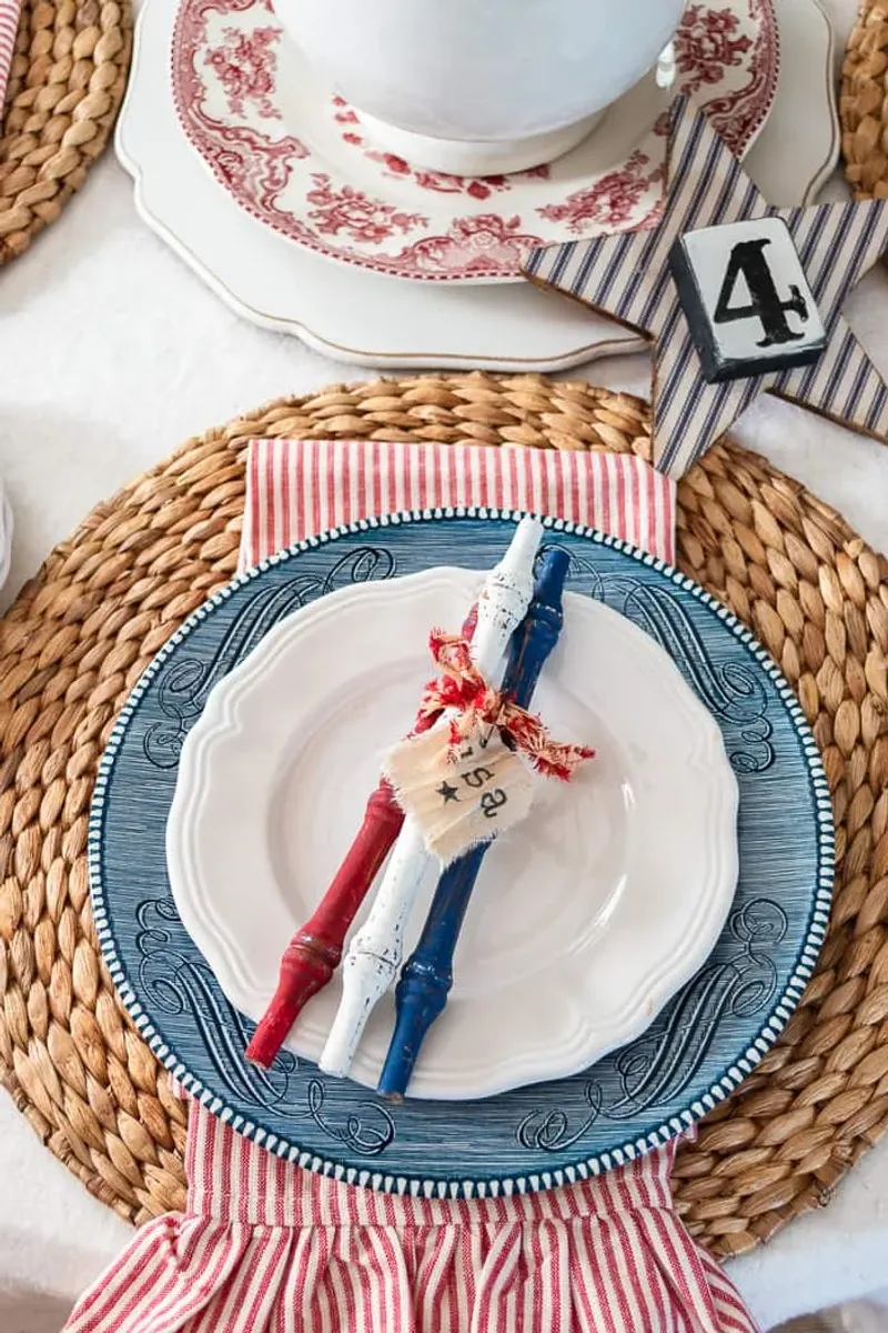 Red Ribbon Tied Around Silverware Bundles