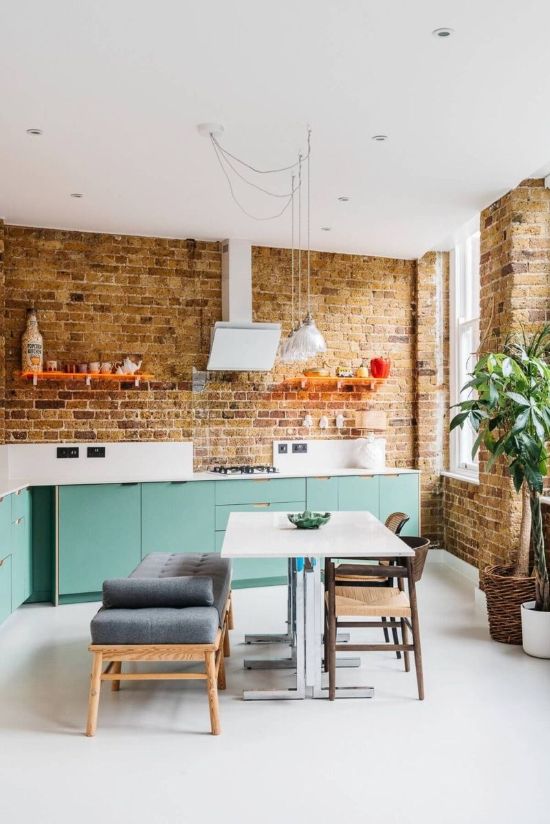 Industrial Exposed Copper Pipes Against Teal Brick Walls