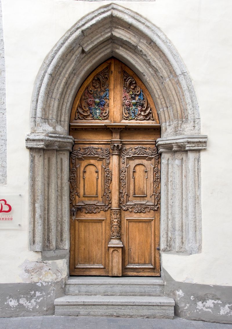 Stone Vestibule with Heavy Carved Doors in a Gothic Revival